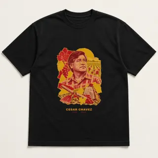 Front of a black tee with a three-color mixed-media design for Cesar Chavez