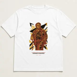 Front of a white tee carrying the civic modern Cesar Chavez design