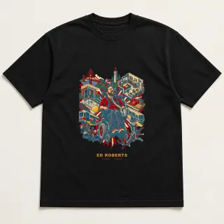 Front of a black tee with a four-color pixel-art design for Ed Roberts