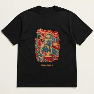Front of a black tee with a three-color mixed-media design for Malcolm X