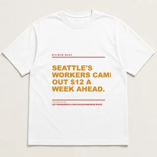 Front of a white tee reading "Seattle's workers came out $12 a week ahead." with the Minimum Wage page address printed under it