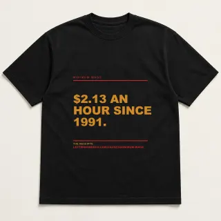 Front of a black tee reading "$2.13 an hour since 1991." with the Minimum Wage page address printed under it