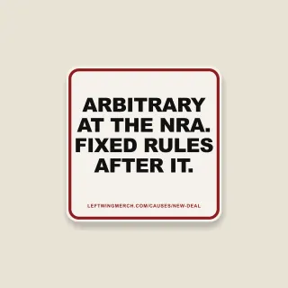 A cream square sticker with a red frame reading "Arbitrary at the NRA. Fixed rules after it."