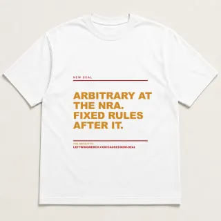 Front of a white tee reading "Arbitrary at the NRA. Fixed rules after it." with the New Deal page address printed under it