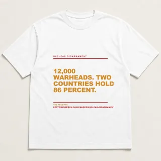 Front of a white tee reading "12,000 warheads. Two countries hold 86 percent." with the Nuclear Disarmament page address printed under it