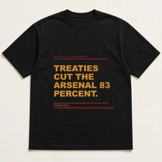 Front of a black tee reading "Treaties cut the arsenal 83 percent." with the Nuclear Disarmament page address printed under it