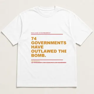 Front of a white tee reading "74 governments have outlawed the bomb." with the Nuclear Disarmament page address printed under it