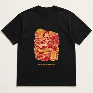 Front of a black tee with a three-color mixed-media design for Woody Guthrie